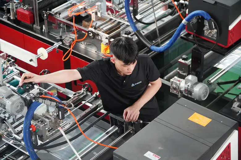 Operator running a bag-making machine