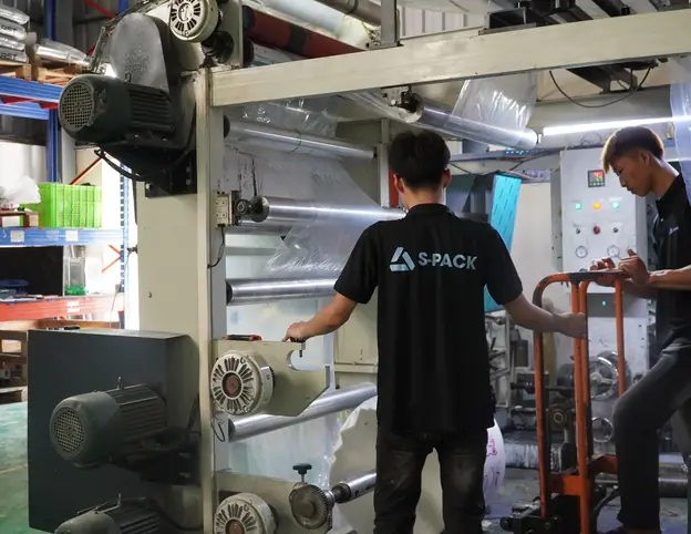 Operators running a printing machine